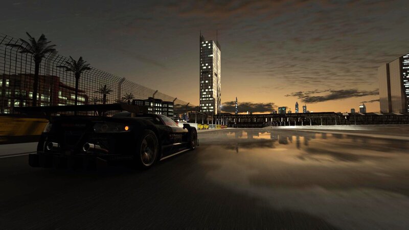 race car on wet track at dusk