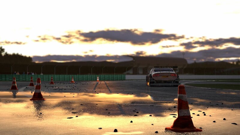 Race car on wet track at sunset
