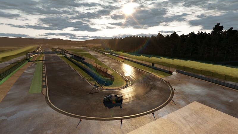 race car on wet track at sunset