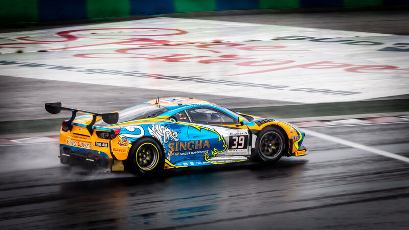 Race Car on Wet Track — Blue