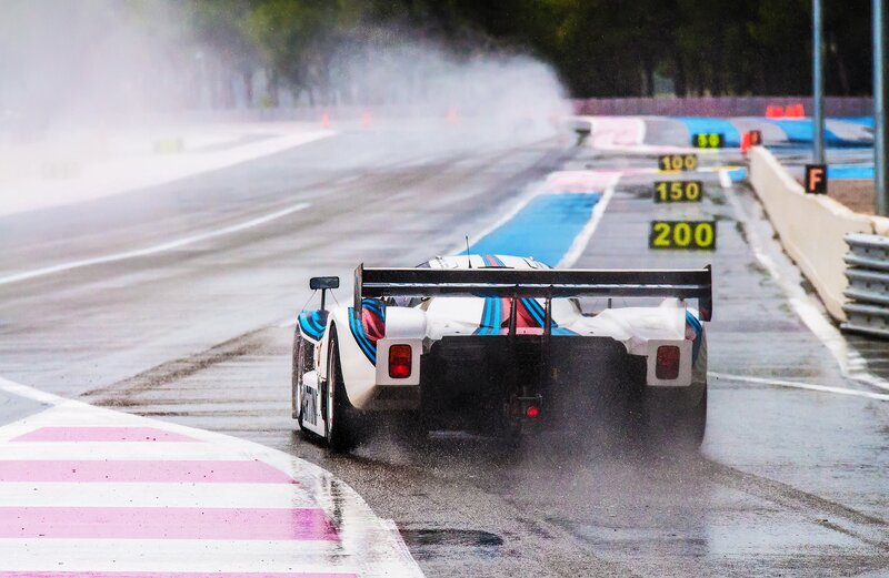 Race Car on Wet Track — White