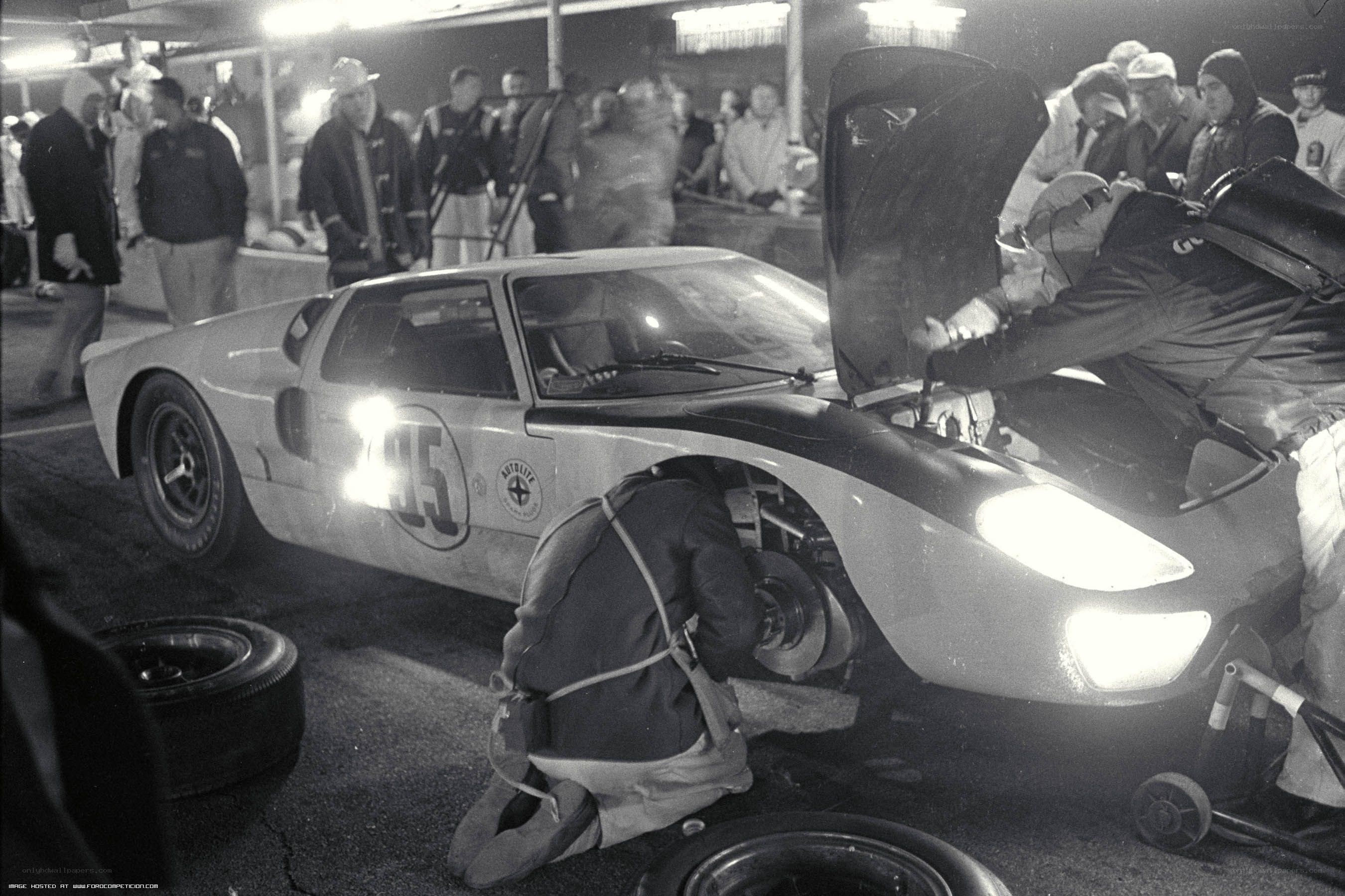Race car pit stop at night