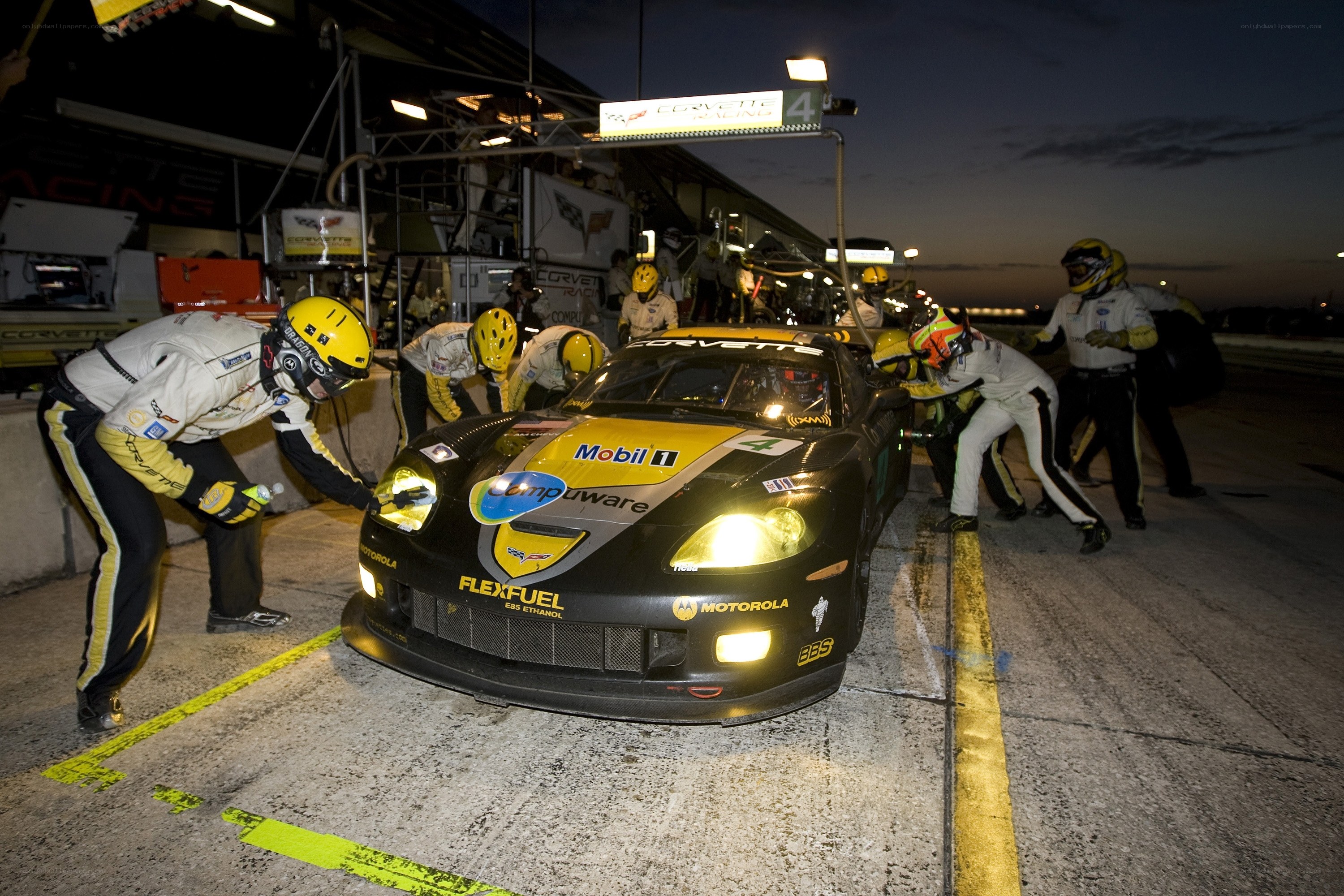 Race car pit stop at night