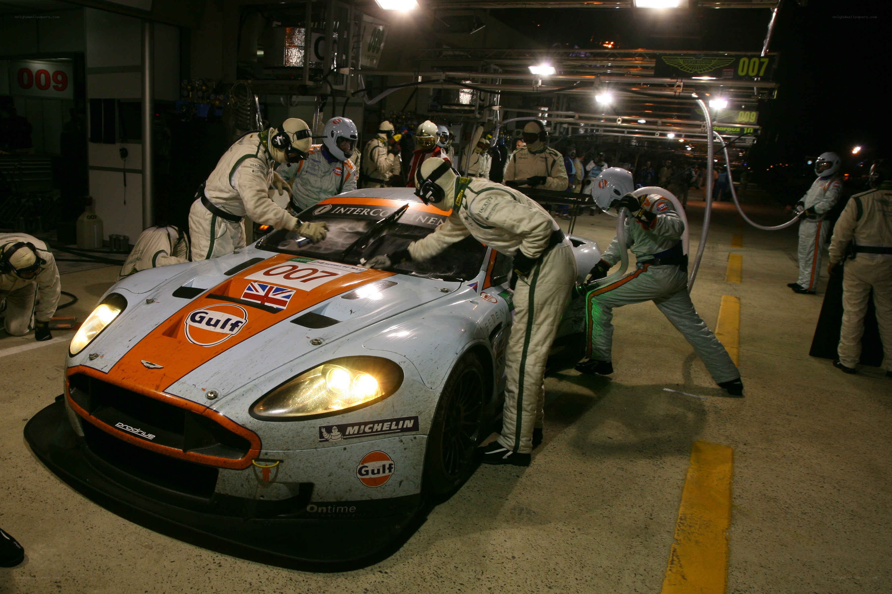 Race car pit stop at night
