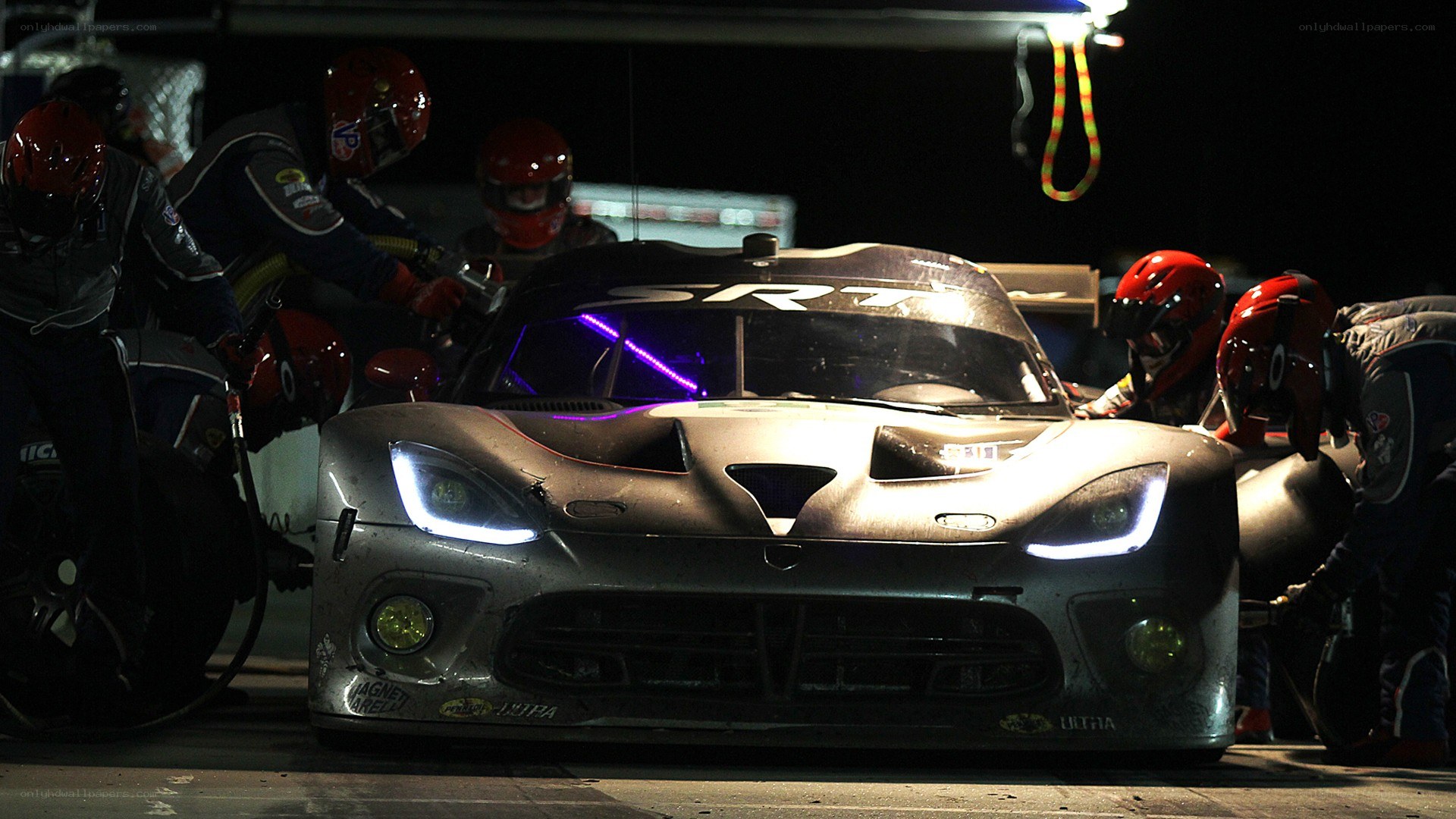 Race car pit stop at night