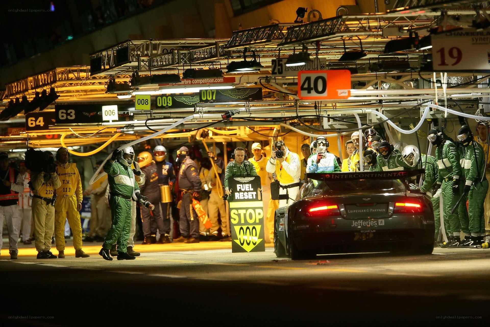 Race car pit stop at night