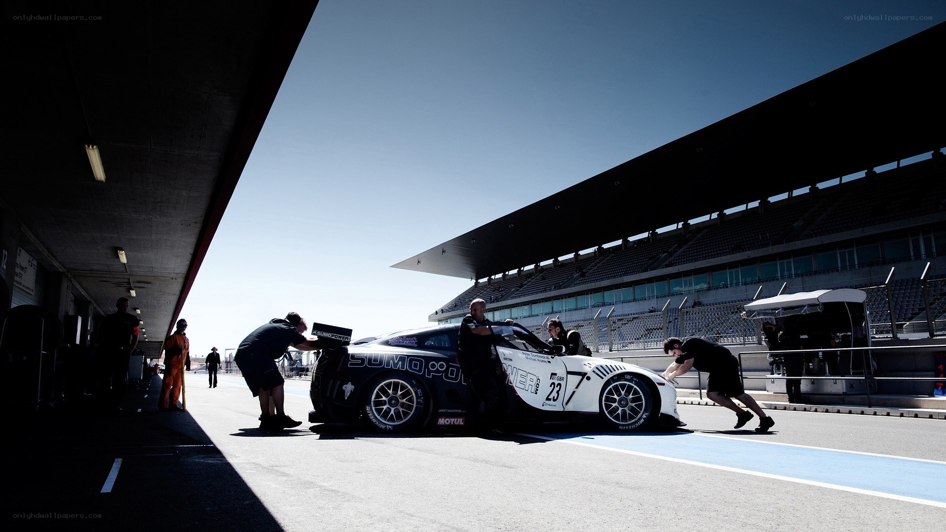 Race car pit stop at racetrack