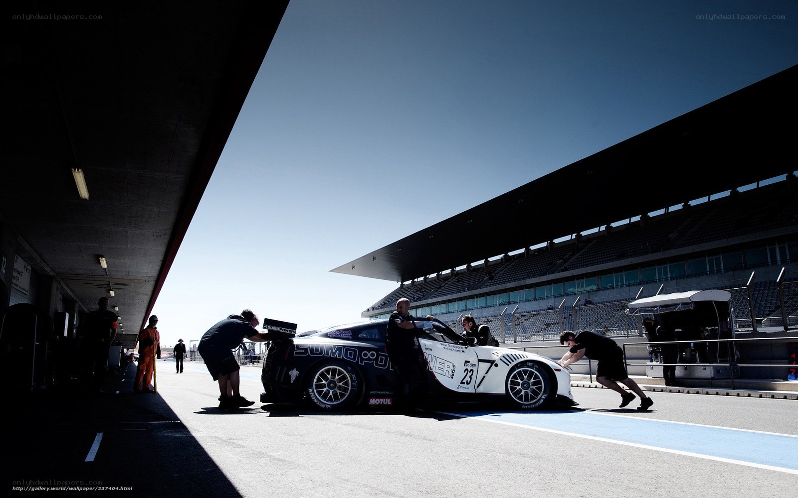 Race car pit stop at racetrack