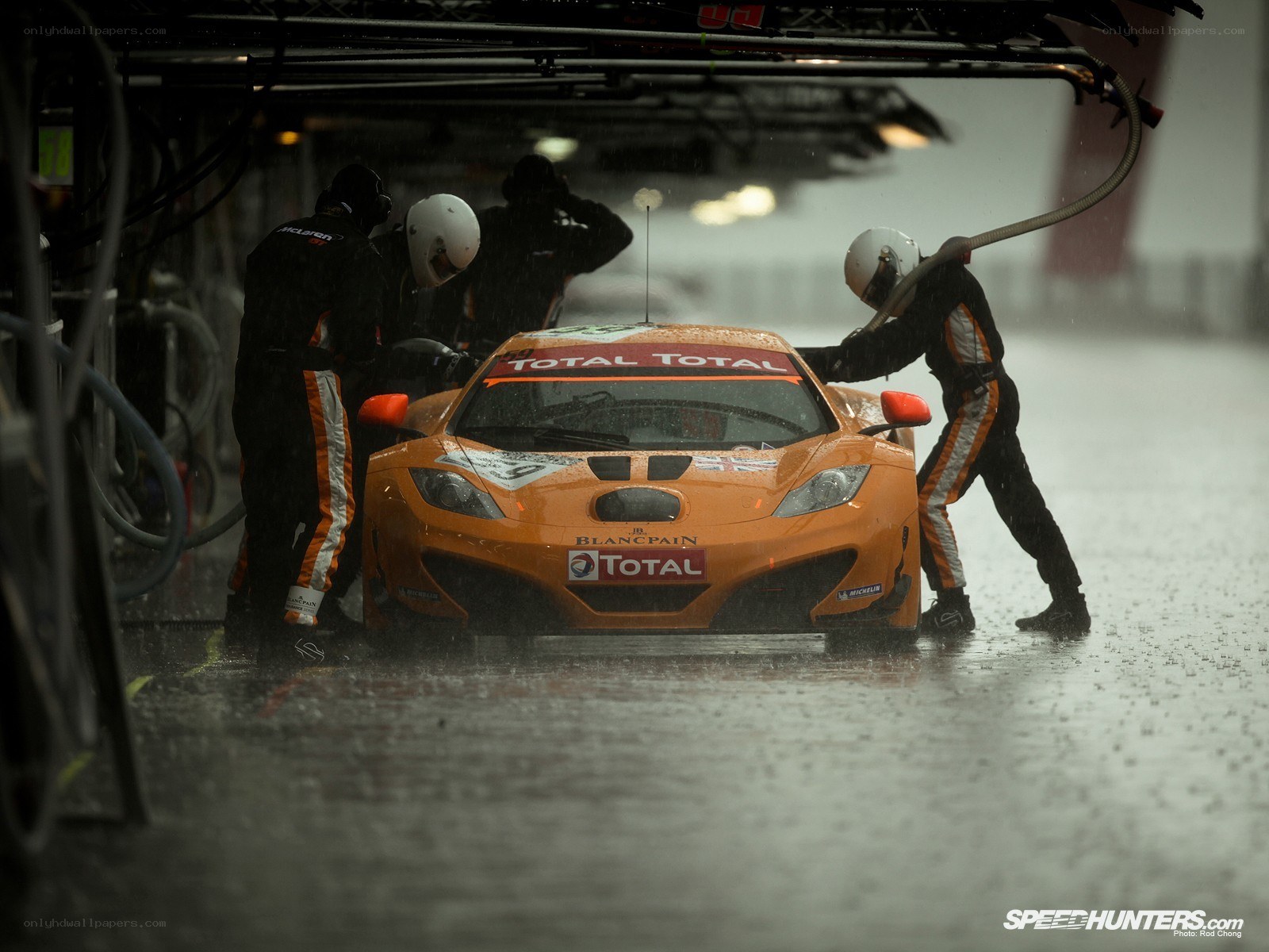 Race car pit stop in rain