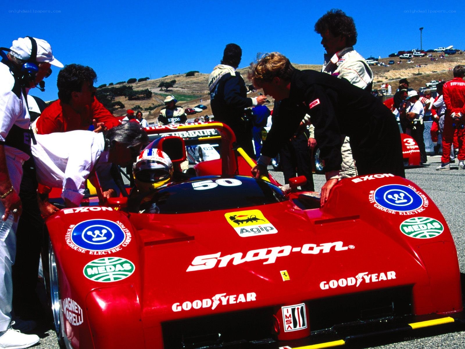Race car pit stop with driver