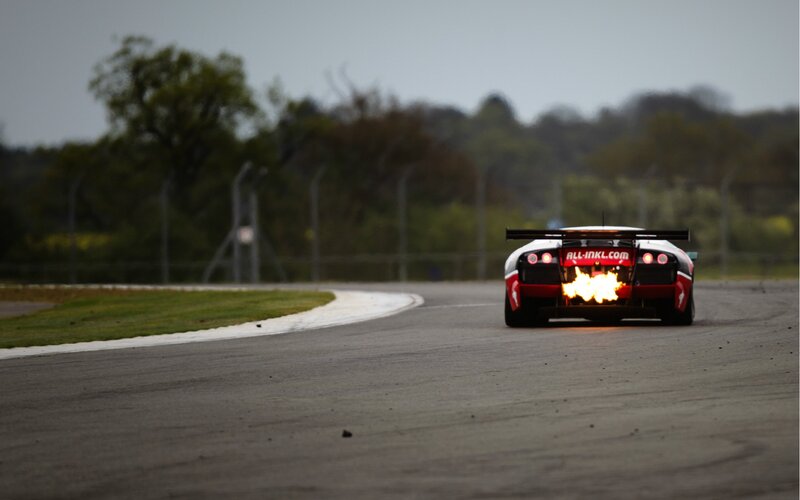 Race car with flames on track