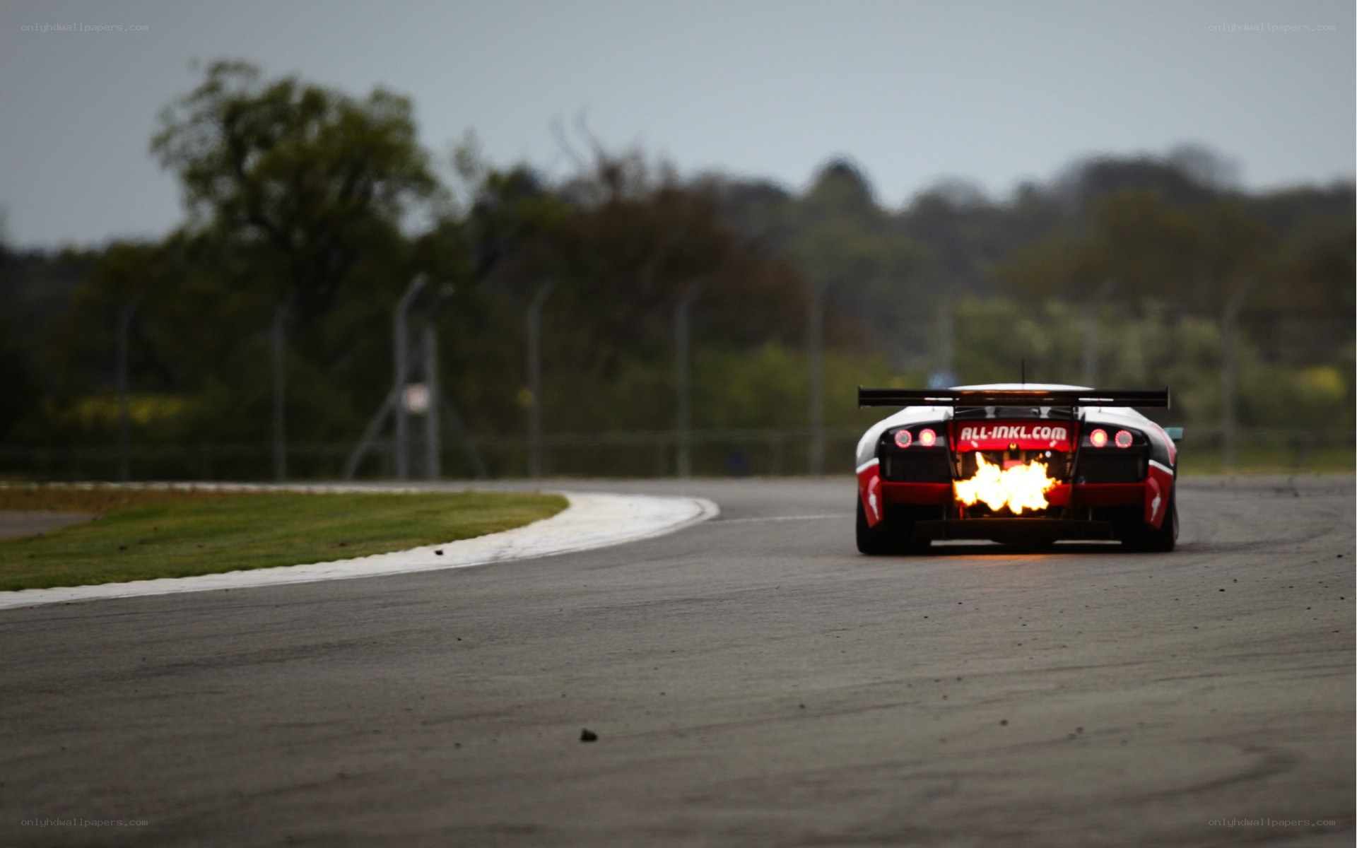 Race car with flames on track