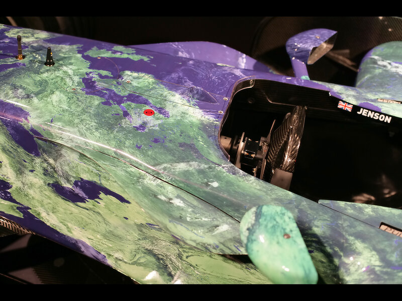 Race car with green and purple livery