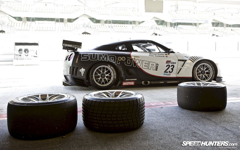 Race car with tires in pit lane
