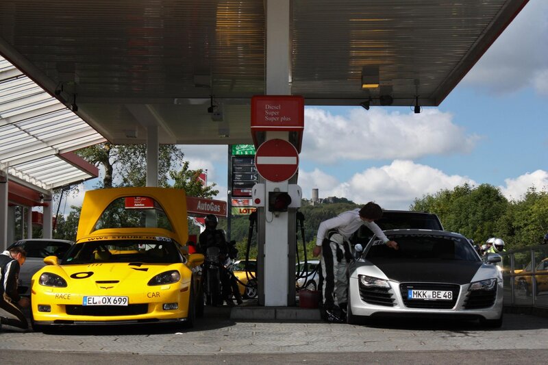 Race cars at a gas station