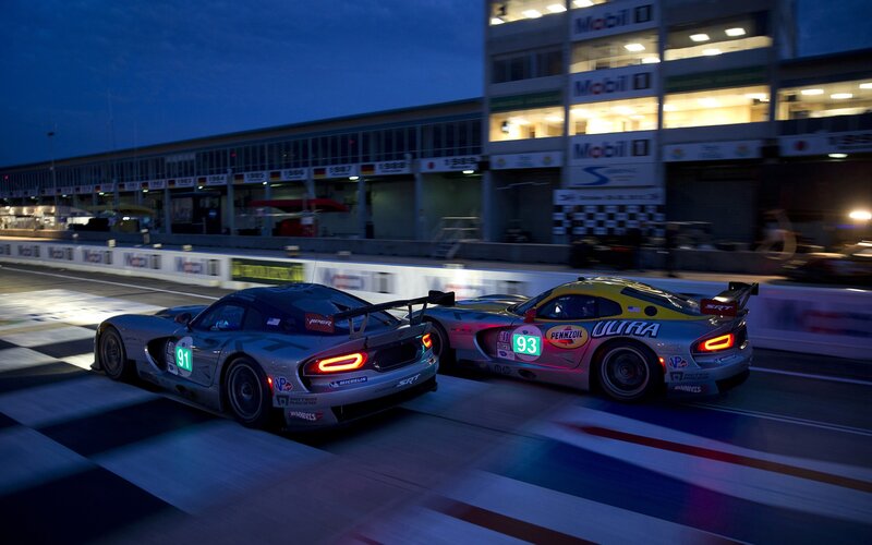 Race cars at dusk