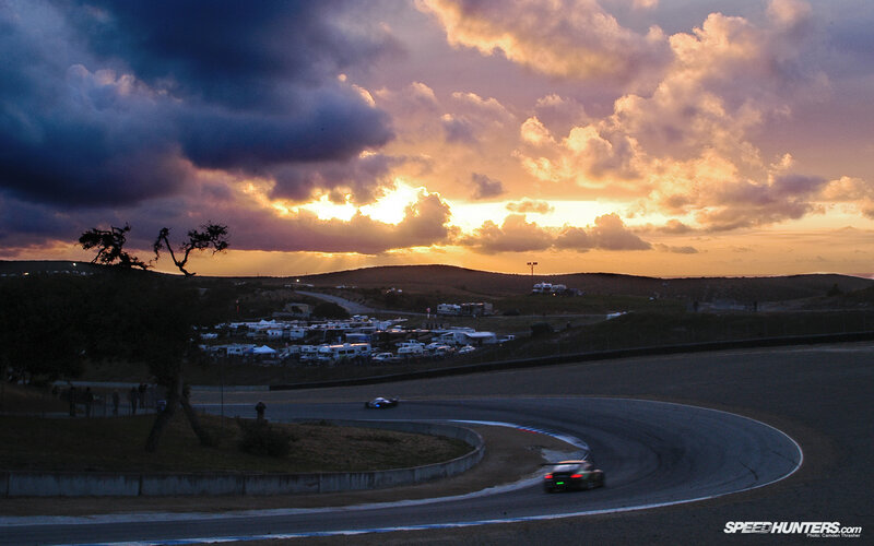 Race cars at sunset on a track