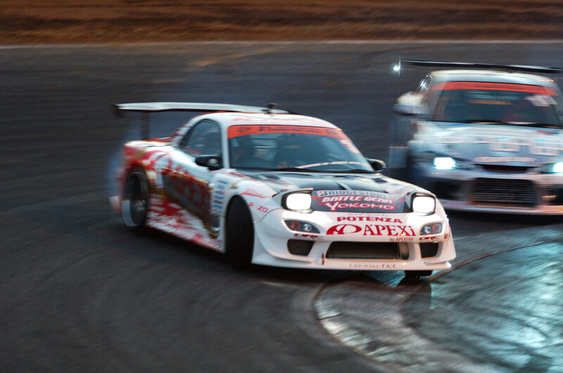 Race cars drifting on track
