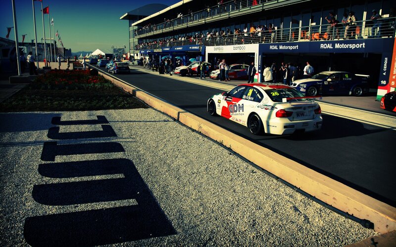 Race cars in pit lane