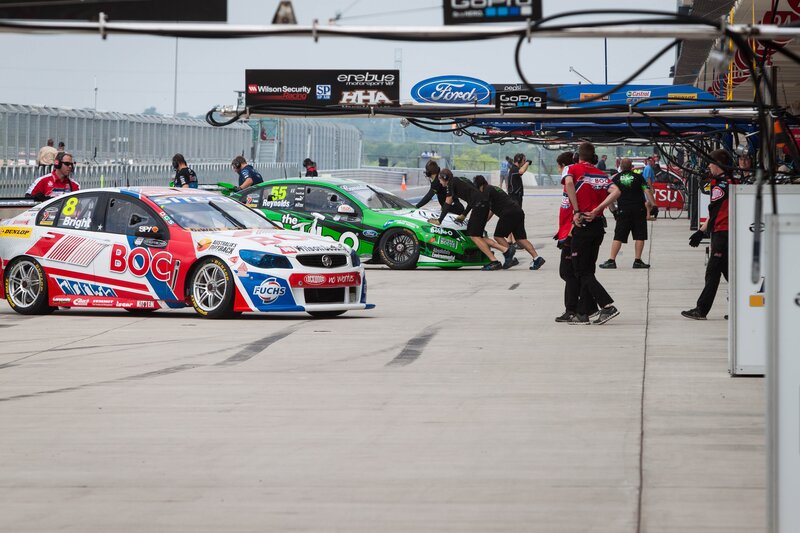 Race cars in pit lane