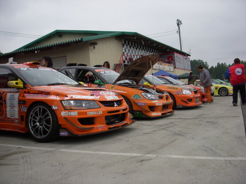 Race cars lined up at a track