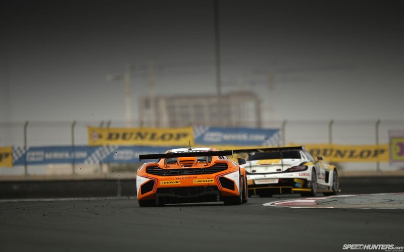 Race cars on a track