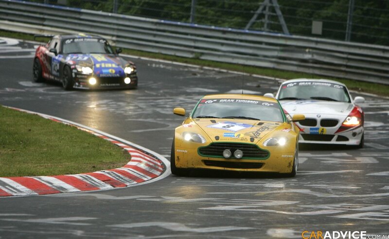 Race cars on a wet track
