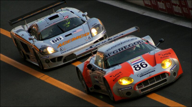 Race cars on track at night