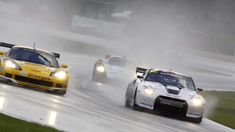 Race cars on wet track