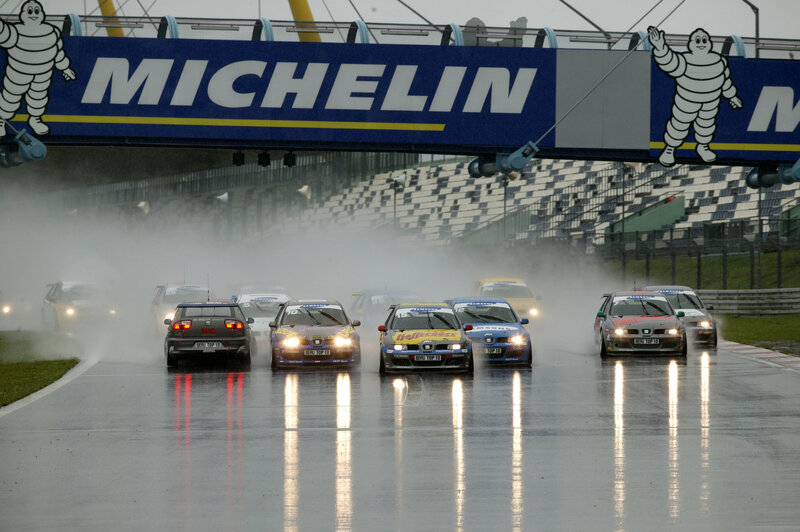 Race cars on wet track