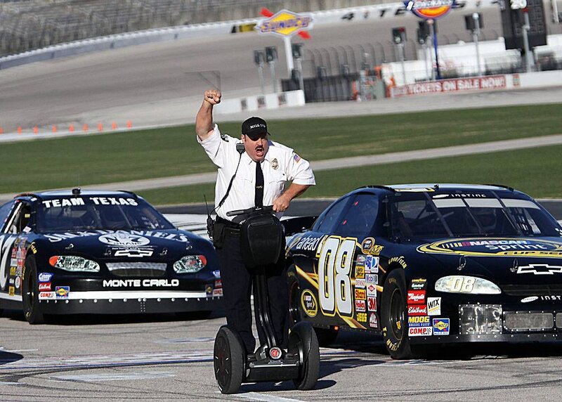Race official on Segway at racetrack