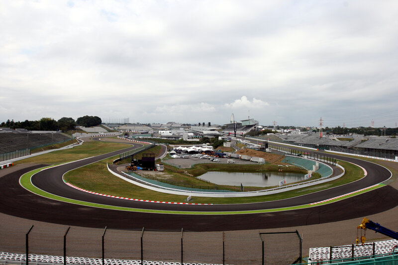 race track with pond and grandstands