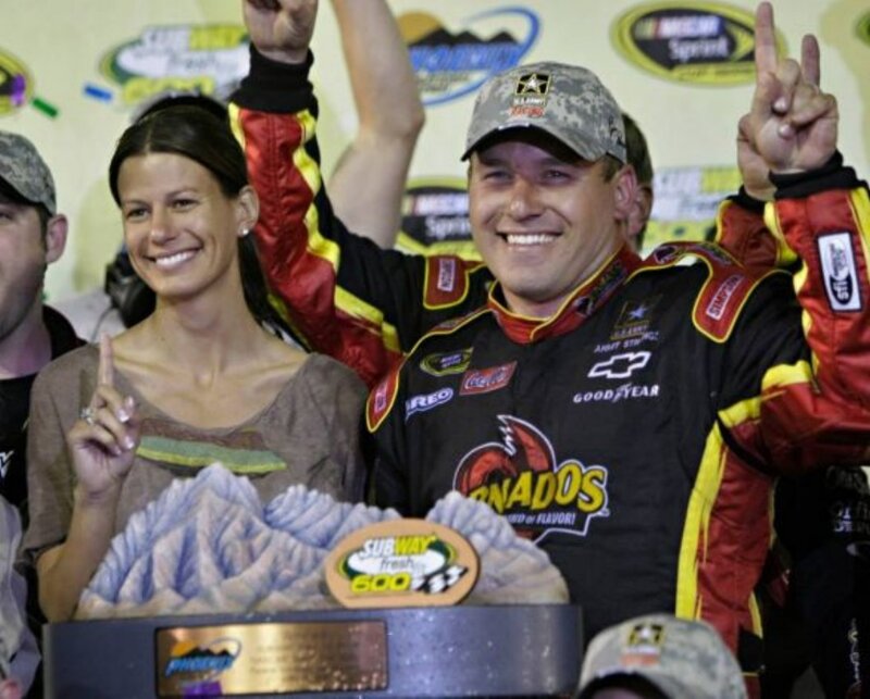 Race winner celebrates with trophy