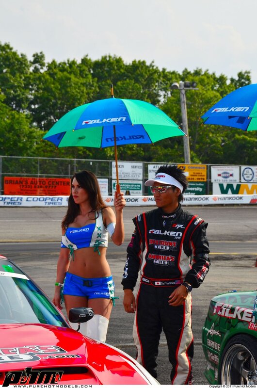 Racer and promotional model at track