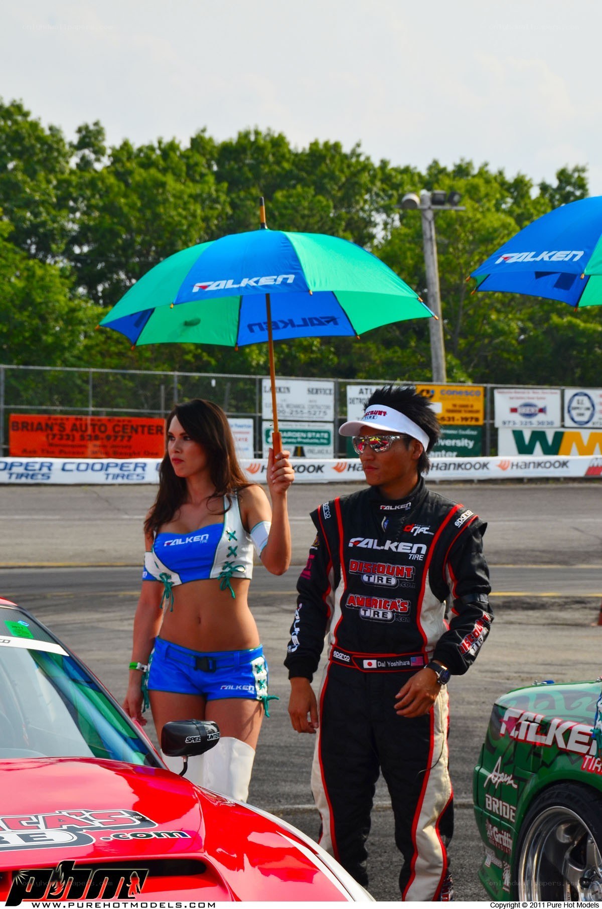 Racer and promotional model at track