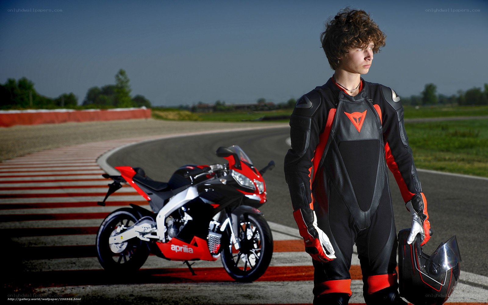 racer with motorcycle on track