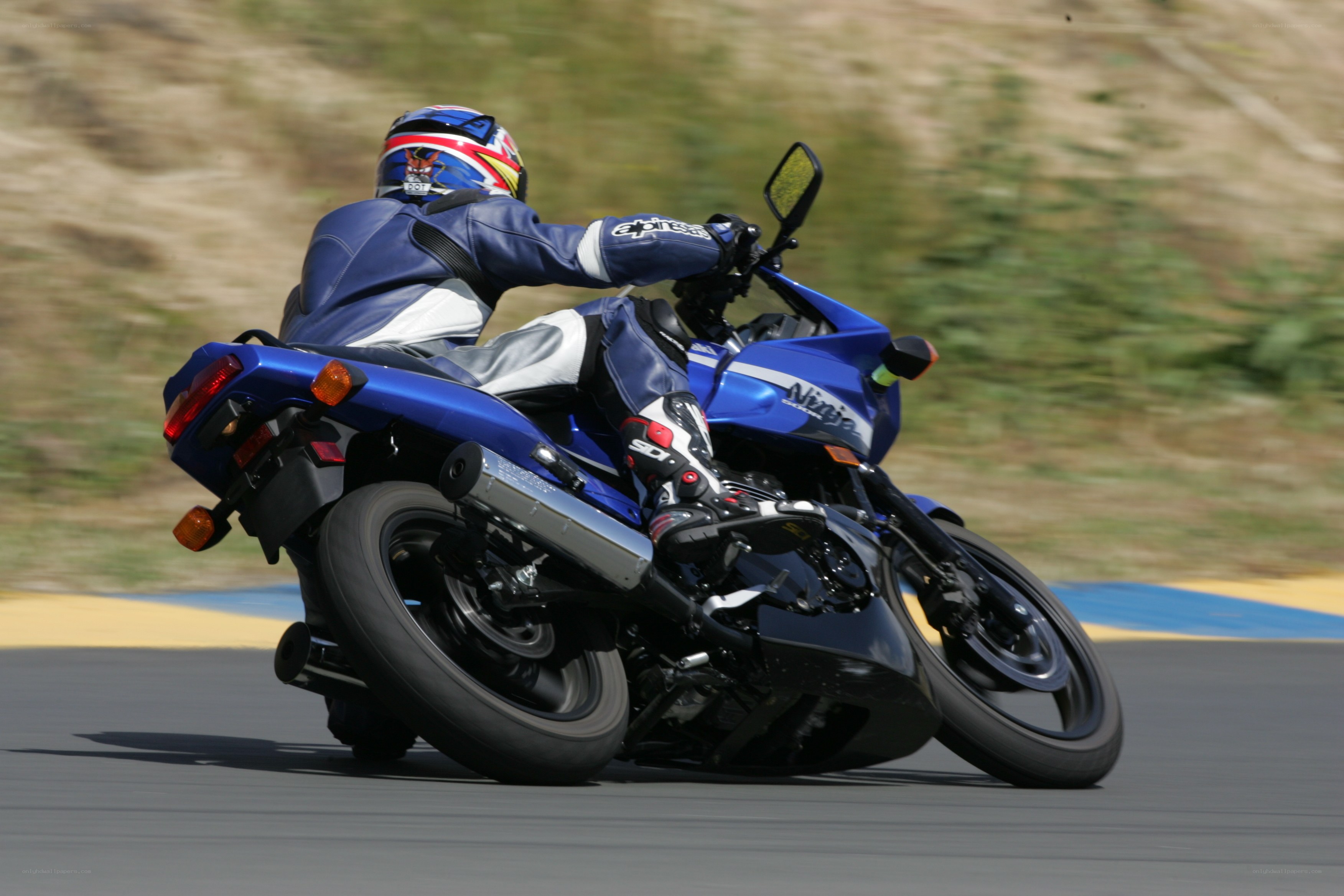 racing a blue motorcycle