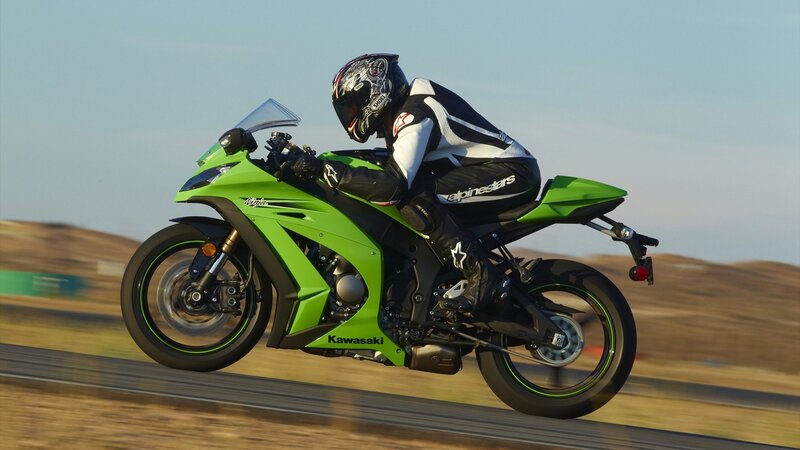 Racing a green Kawasaki motorcycle
