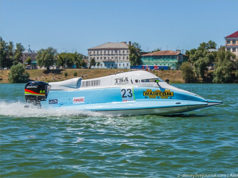 Racing Boat on Water — Blue, Active