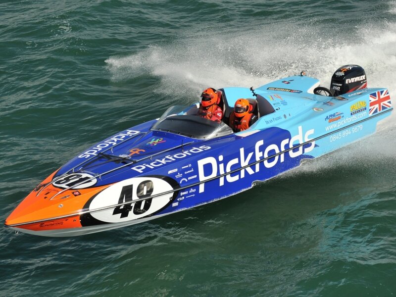 Racing Boat on Water — Blue, Dynamic, Afternoon, Photograph, People, Helmets, Ocean