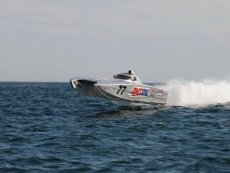 Racing Boat on Water — Blue, Dynamic, Afternoon, Photograph, Sea, Sky