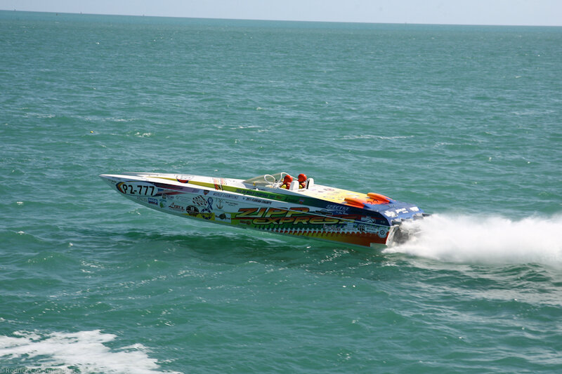 Racing Boat on Water — Blue, Dynamic, Afternoon