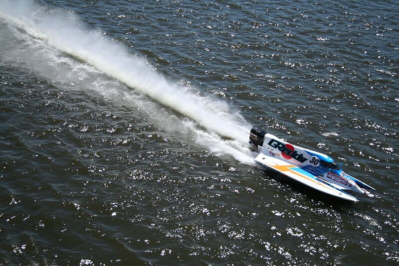 Racing Boat on Water — Blue