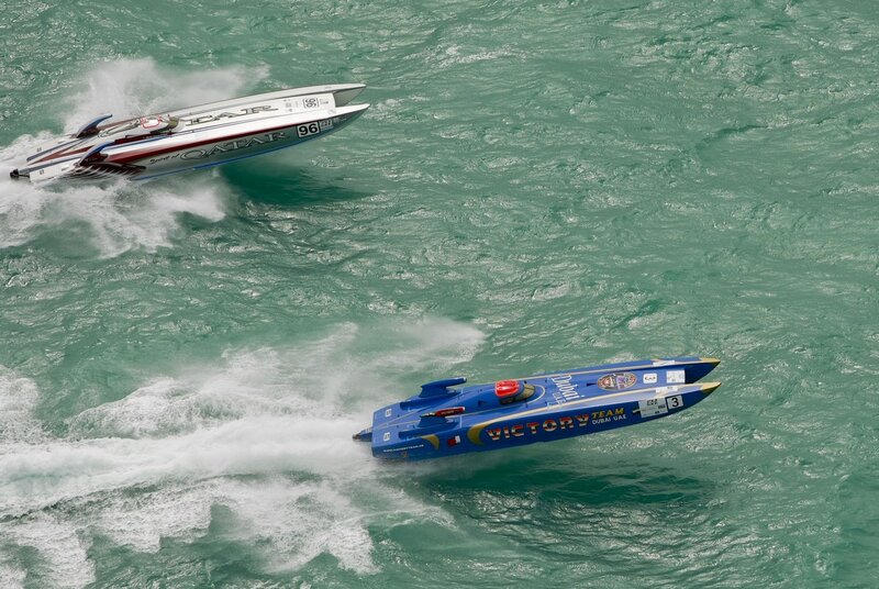 Racing Boats on Water — Blue