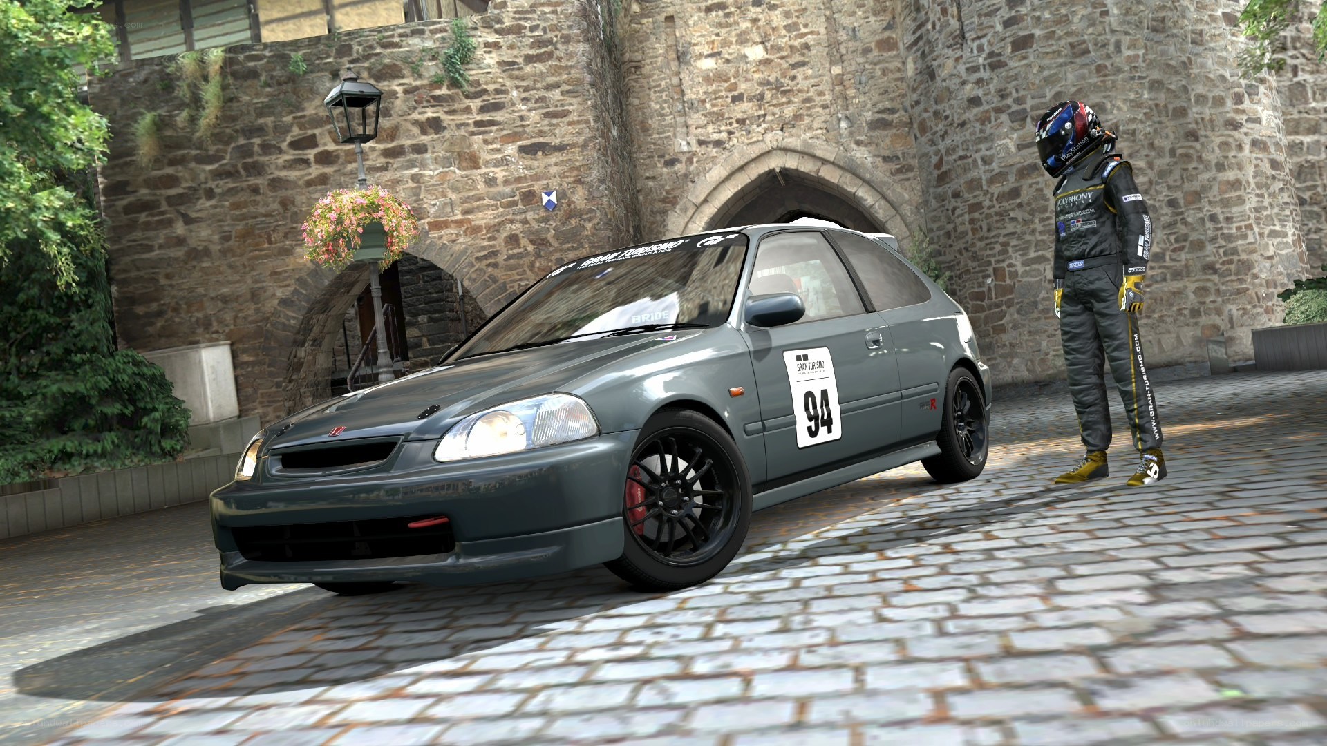 racing car and driver in courtyard