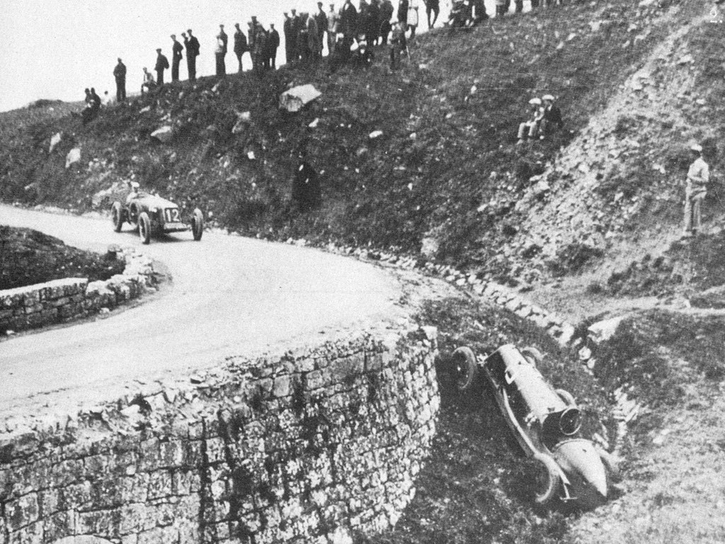 Racing car crash on hillside