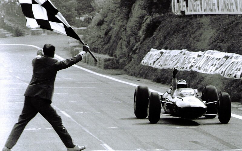 racing car crosses finish line