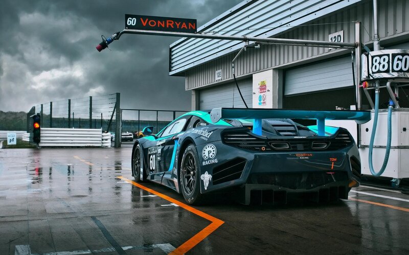 Racing Car in Pit Lane — Black, Dramatic