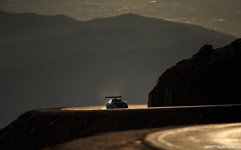 Racing Car on Mountain Road — Black, Dramatic, Sunset, Photograph