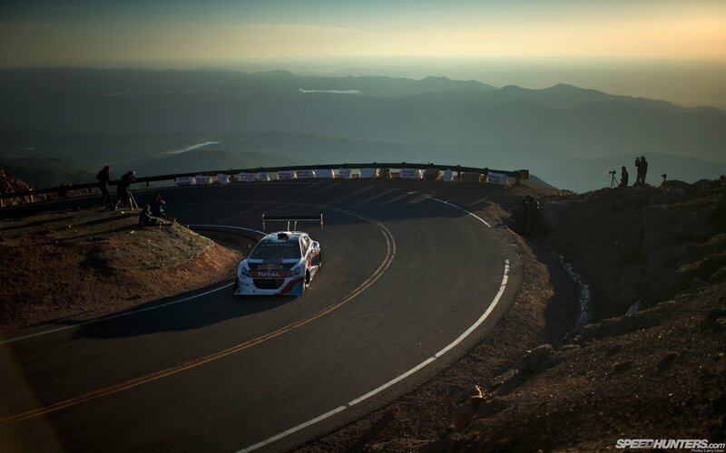 Racing Car on Mountain Road — Black, Dramatic, Sunset